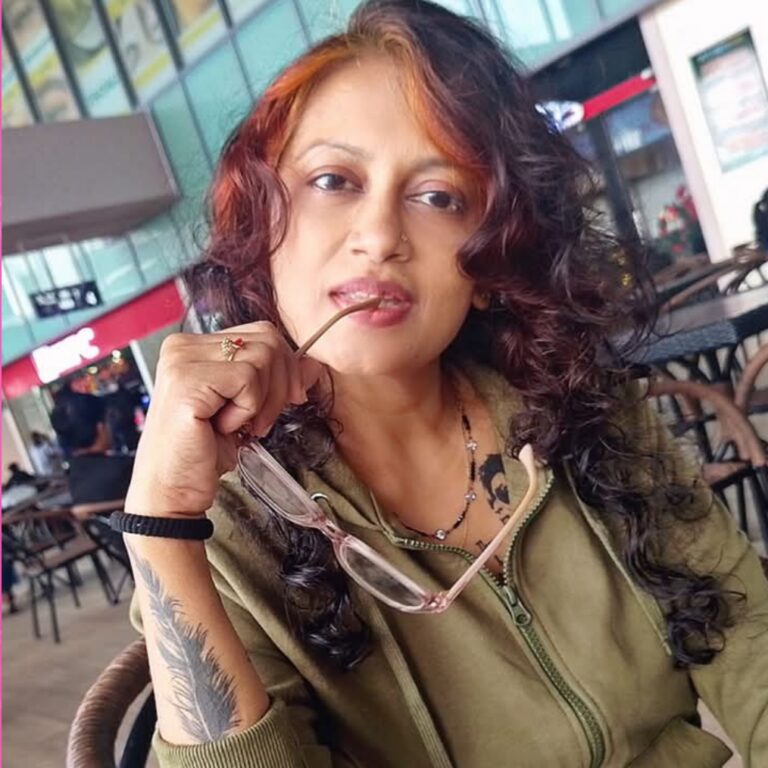 Tharaka Wasalamudaliarachchi wearing a Green Hoodie