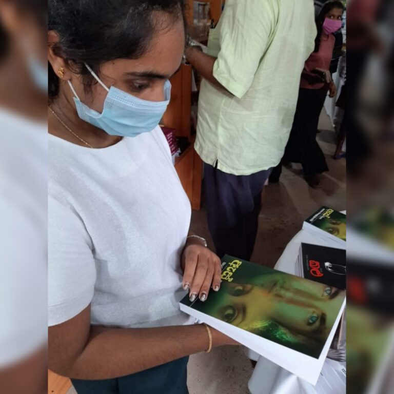 Tharu Queen A fan of Tharaka Wasalamudaliarachchi checking out her "Aes" book