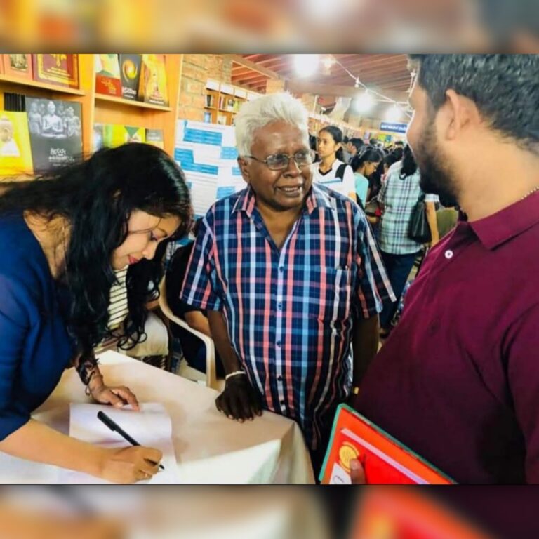 Tharu Queen Tharaka Wasalamudaliarachchi singing an autograph to a fan