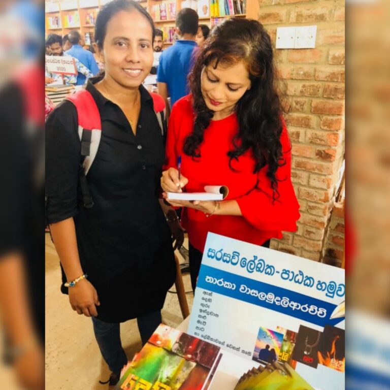 Tharu Queen Tharaka Wasalamudaliarachchi singing an autograph to a fan